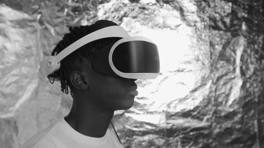 a black and white po of a man wearing vr - reality glasses