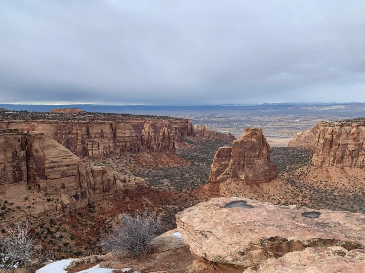 an open desert with mountains in the background