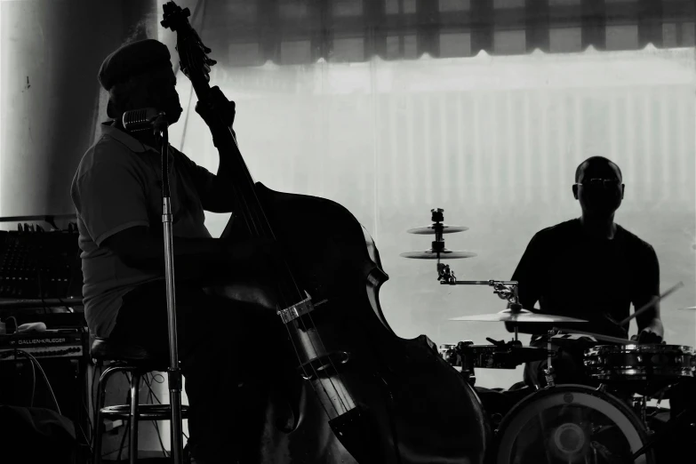 a man in a band plays music for an audience