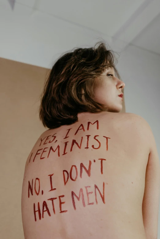 an image of a woman's back with text written on it