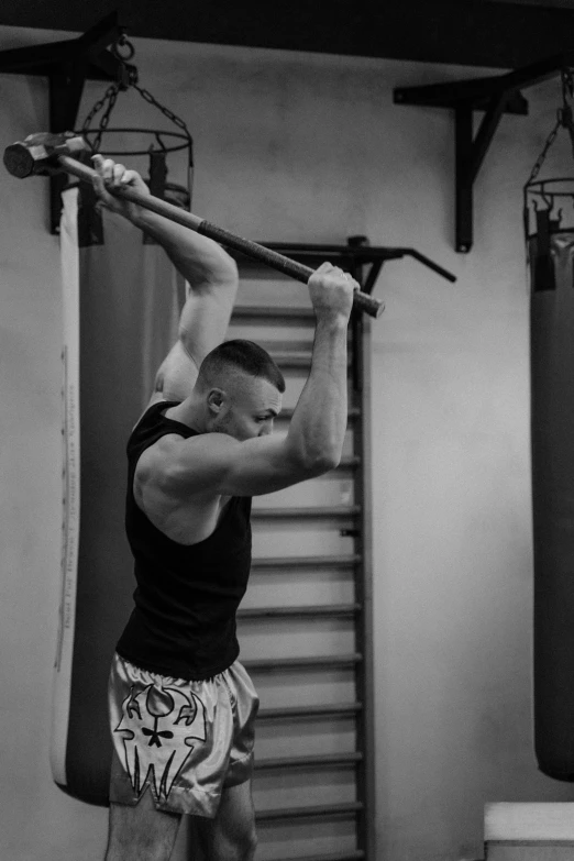 a man doing a back handstand in the air