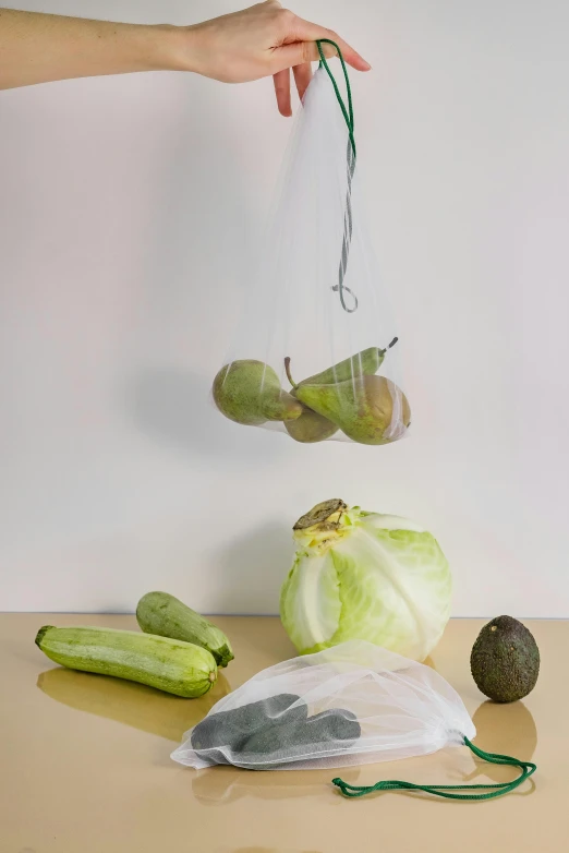 someone is grabbing bag full of vegetables from table