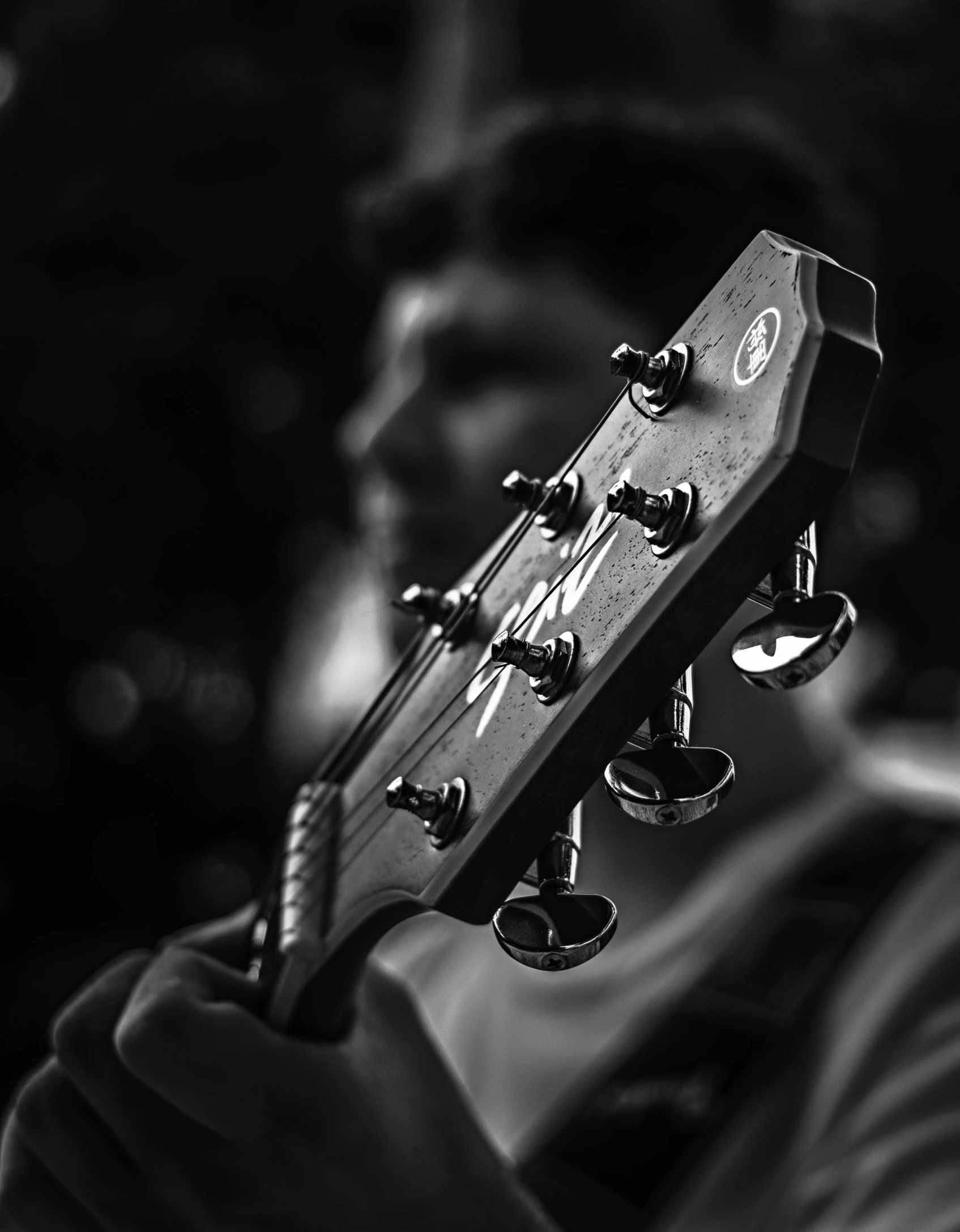 an old guitar is being held by a man