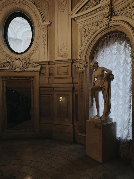 an elaborate room with a statue sitting in the middle of the room