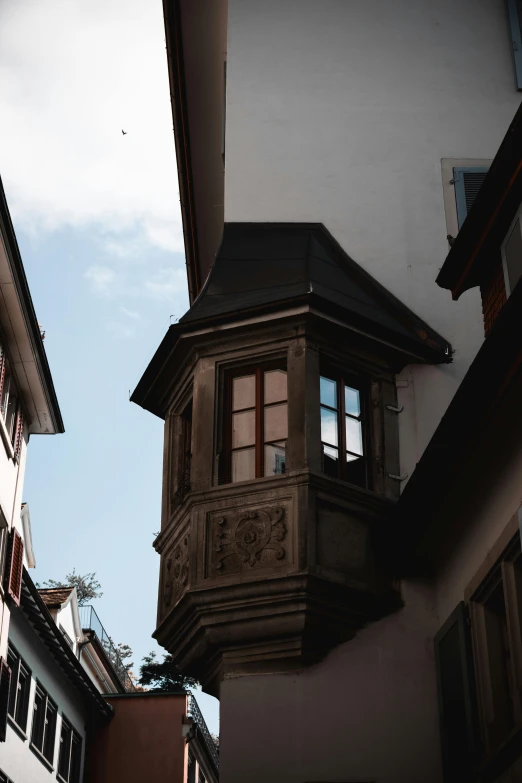 an old building with a weather vane on top