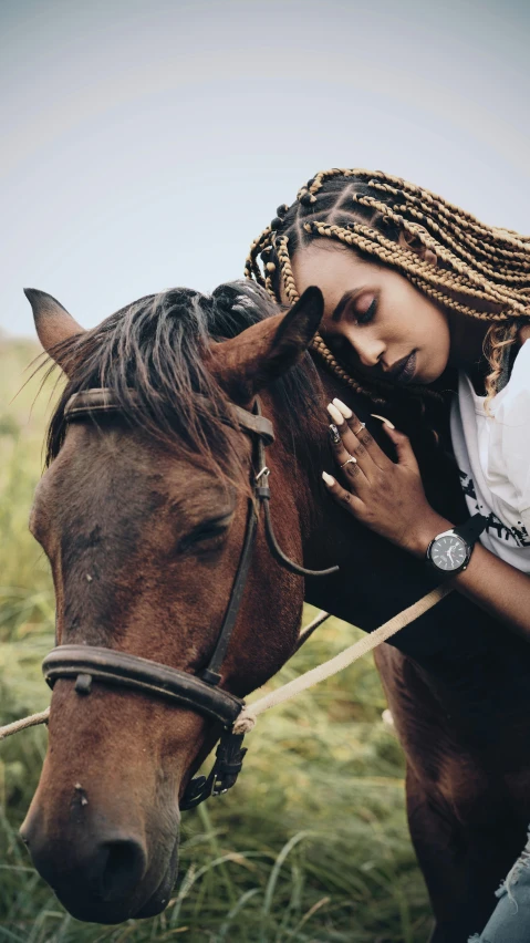 a woman that is sitting on a horse