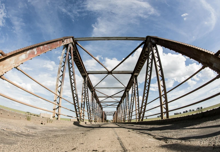 a bridge is shown on top of dirt