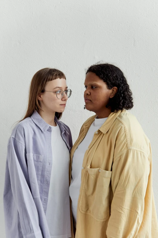 a couple of women standing next to each other