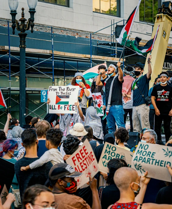 a group of people holding placards in protest