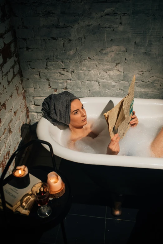 two women are relaxing in the jacuzzi of the bathtub