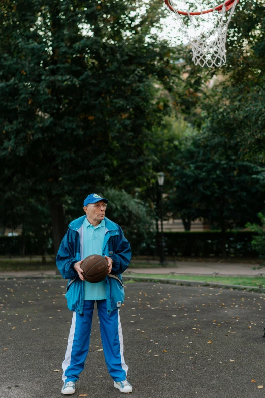 a person that is holding a ball in his hand