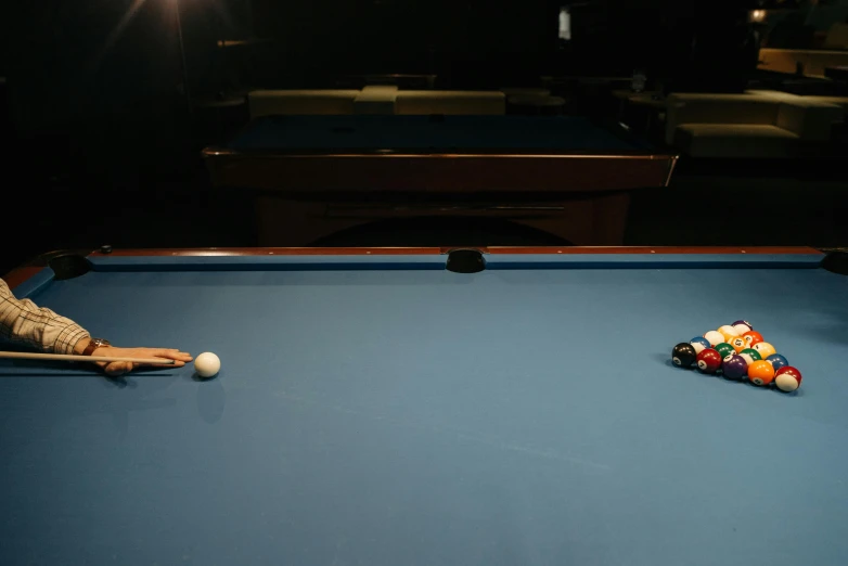 a pool table with cues, a pool ball and billiards