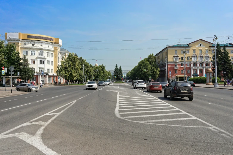 a car and some traffic on a city street