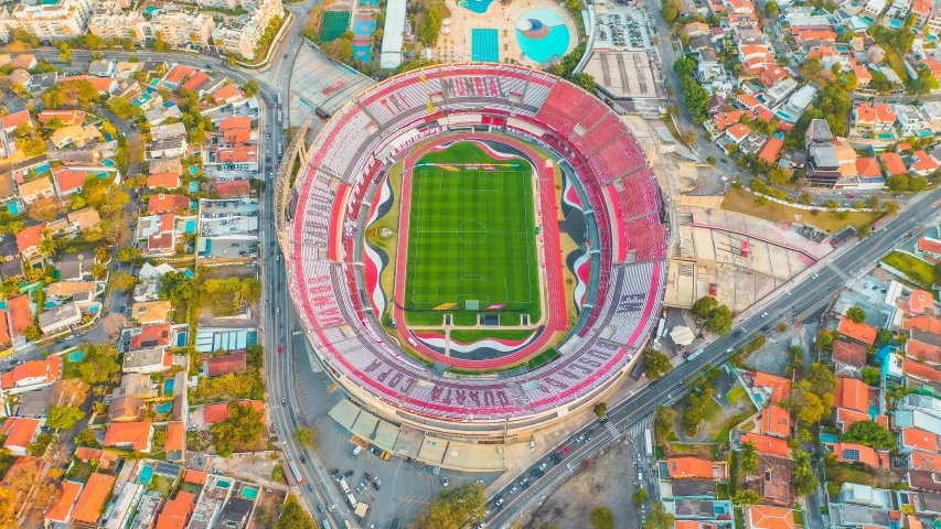 an aerial view of a soccer stadium and surrounding buildings