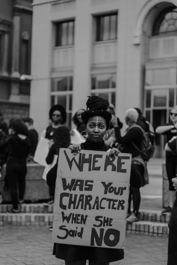 a girl holding a sign with the words we are who you character when she no