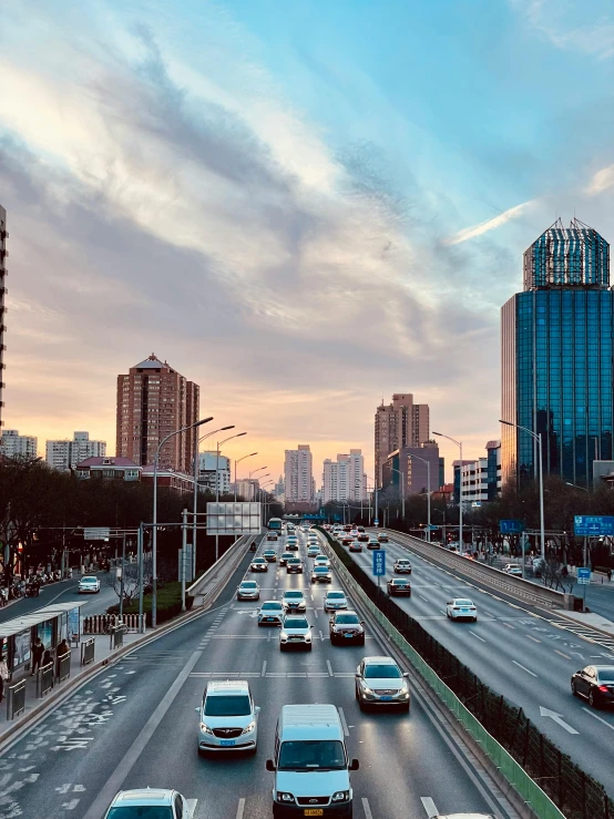 an expressway with heavy traffic during the sunset