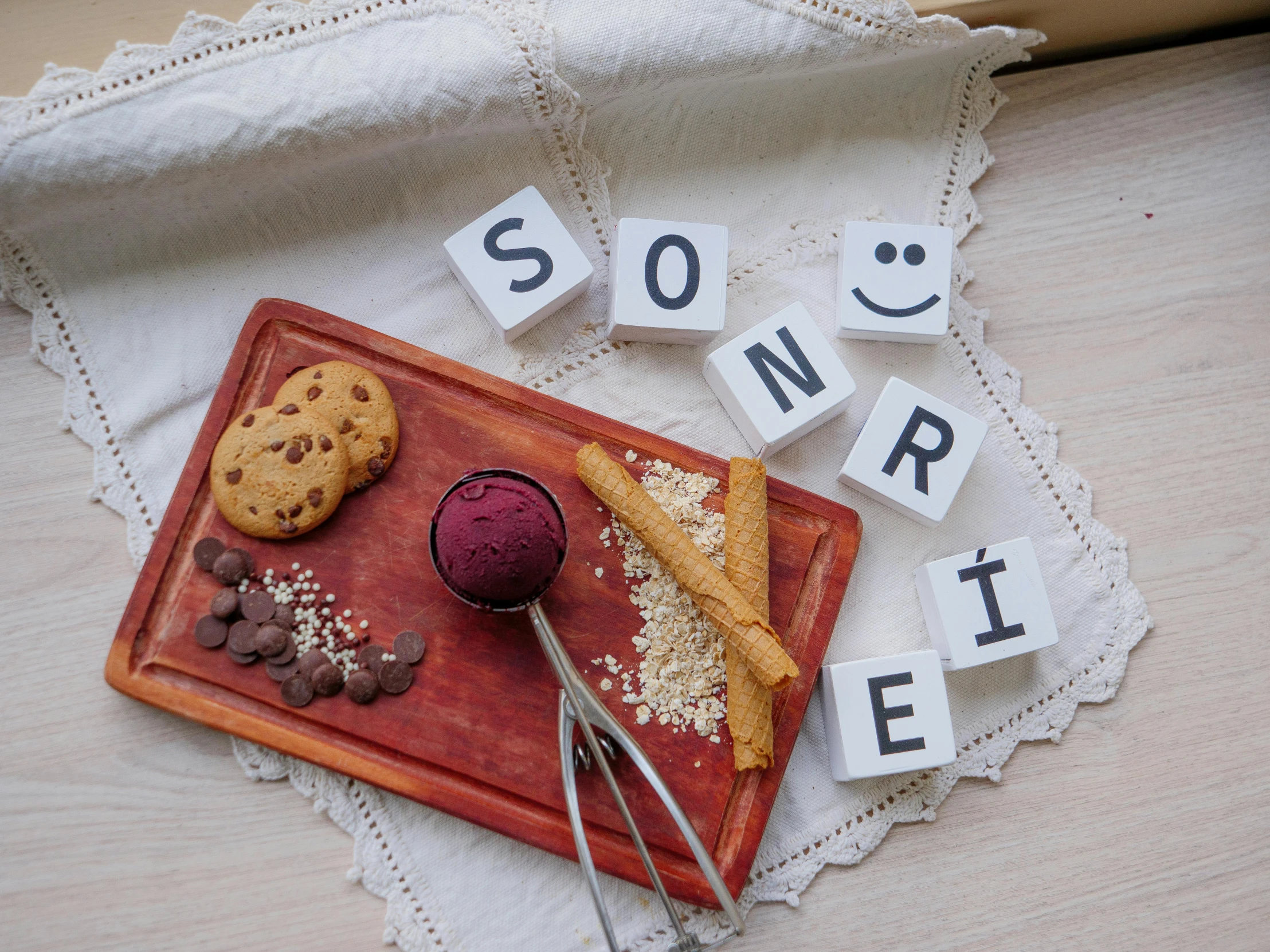 a table topped with words spelling cookies and other food items