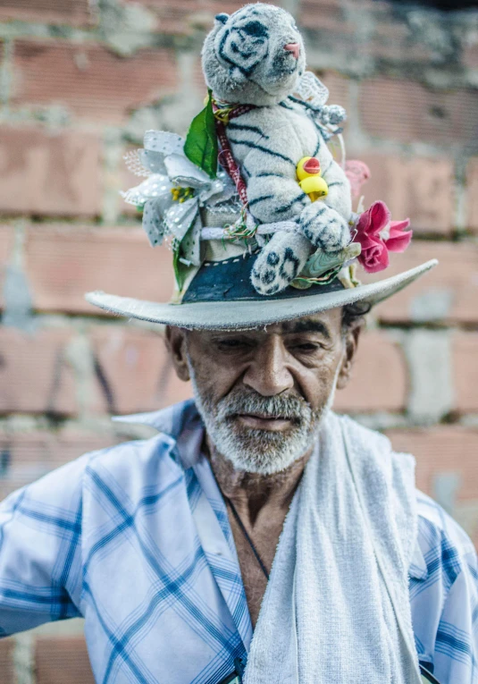 an old man is wearing a tiger costume