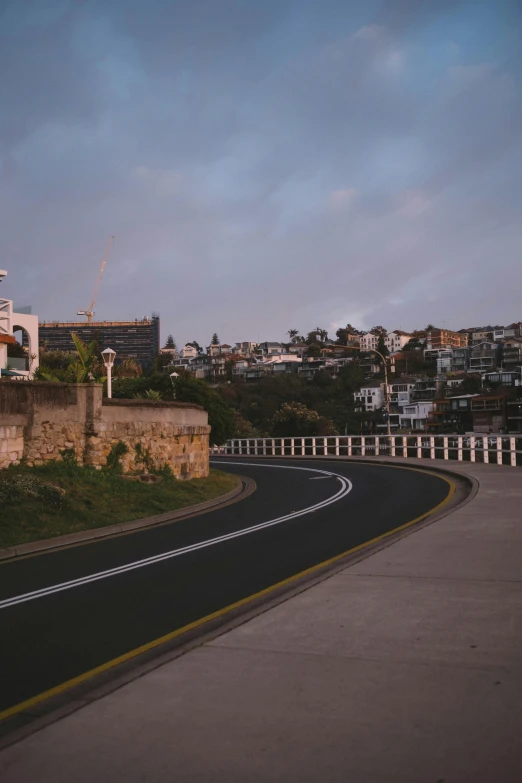 view of a street and a city with a tall building