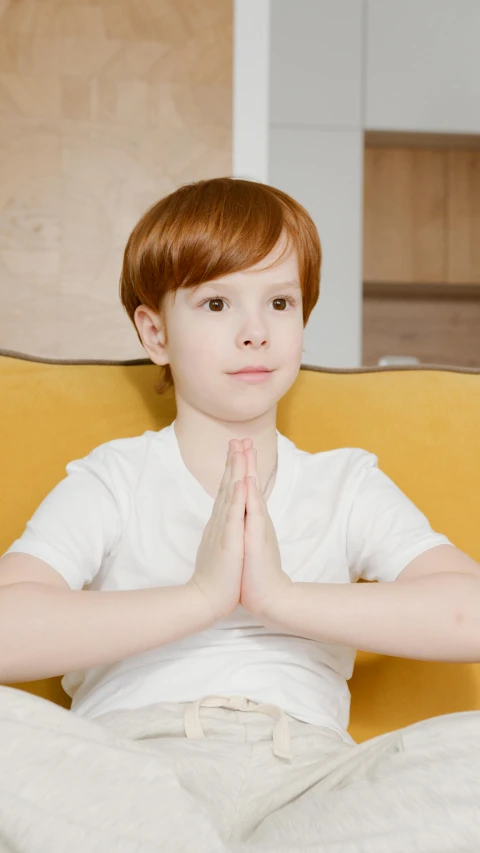 a  doing a hand gestures in his pajamas