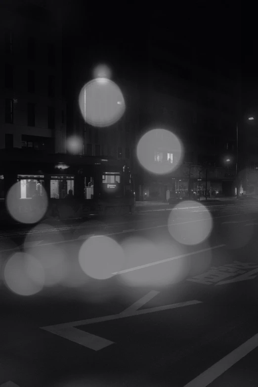 a blurry po of an empty street at night