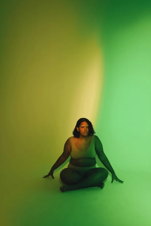 a woman sitting in a light green room