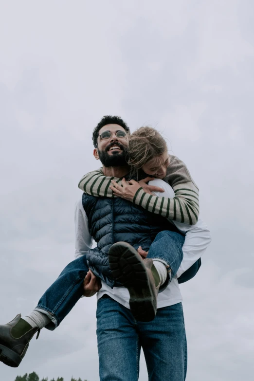 a man holding a woman in the air