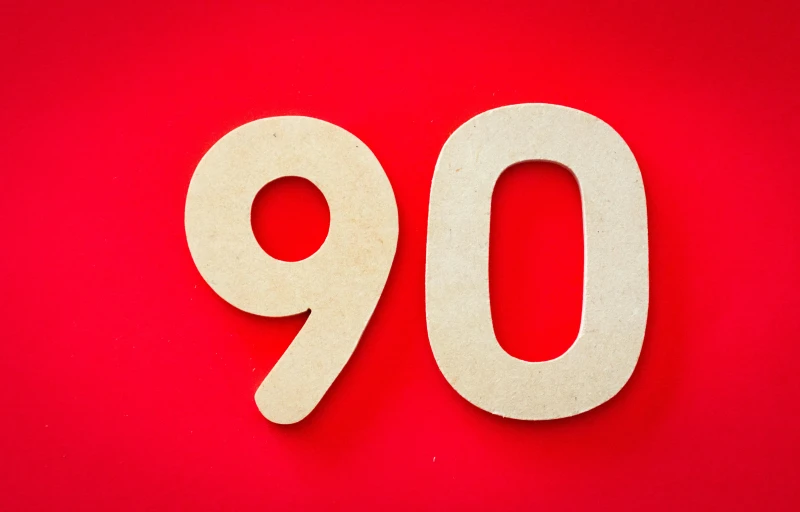 a white sign reading 90 on a red background