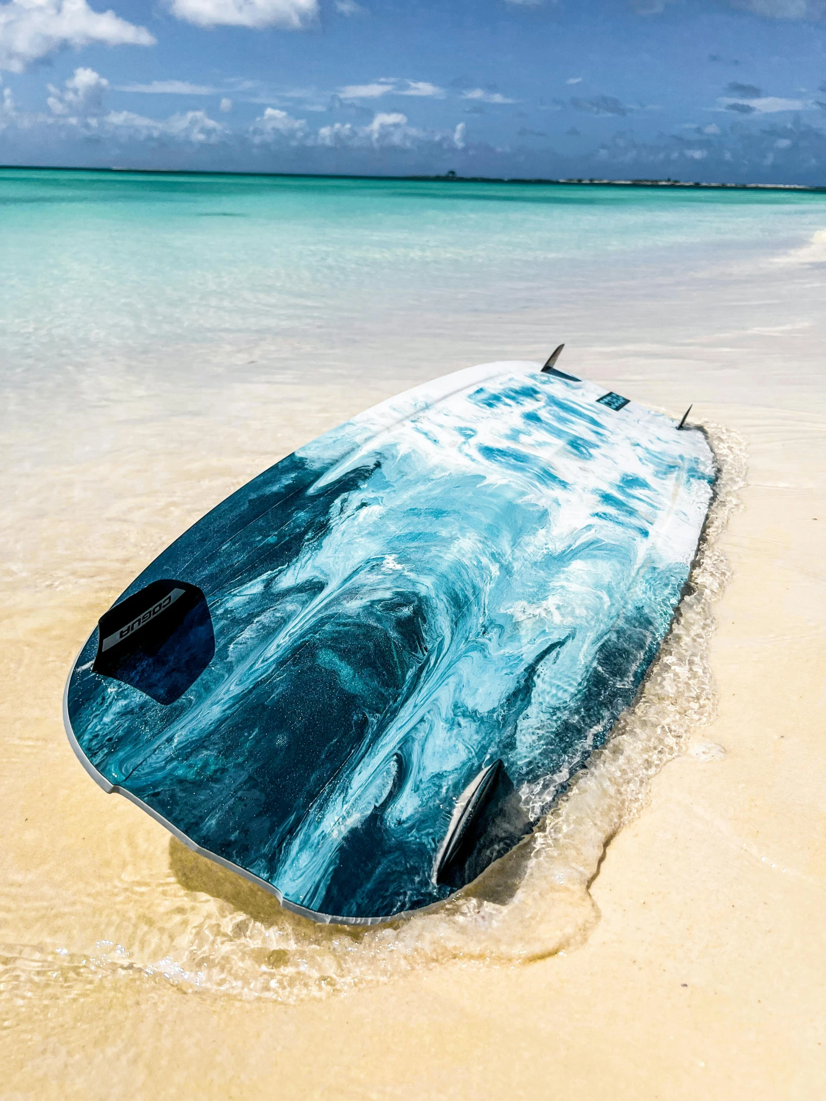 an object on the beach next to water