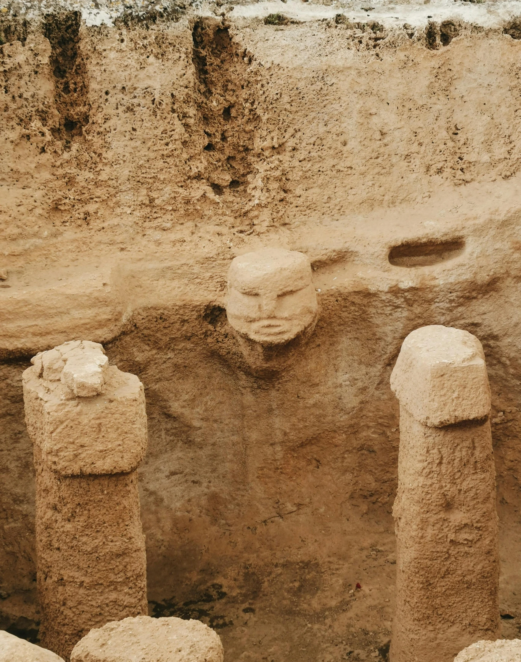 a close up of a group of three statues