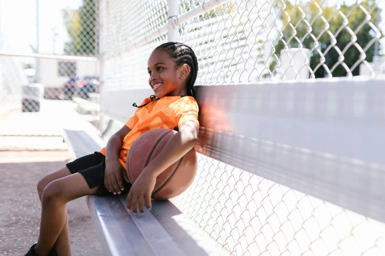 a  is sitting on a bench