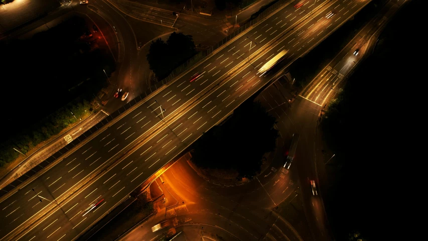 an aerial view of a highway at night