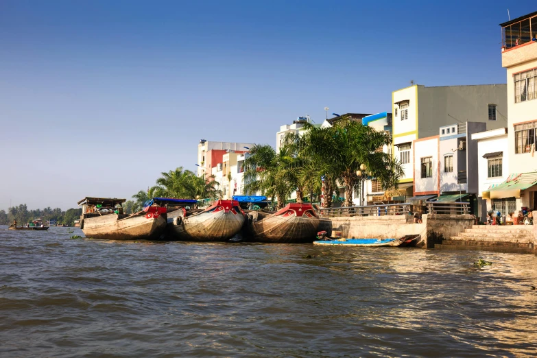 boats on the shore of a body of water