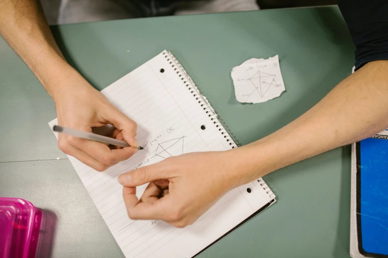 hands are making a piece of paper in order to represent soing special