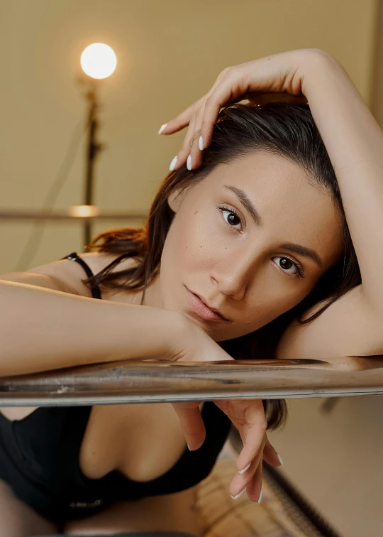 a woman in a black dress posing for a picture