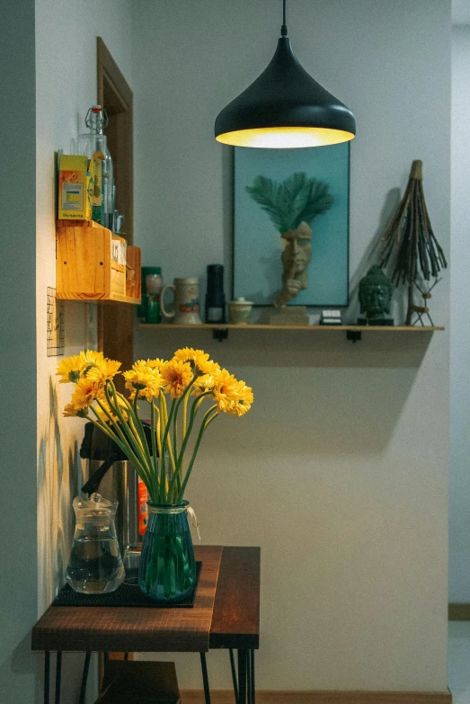 vases with yellow flowers are sitting on a small table