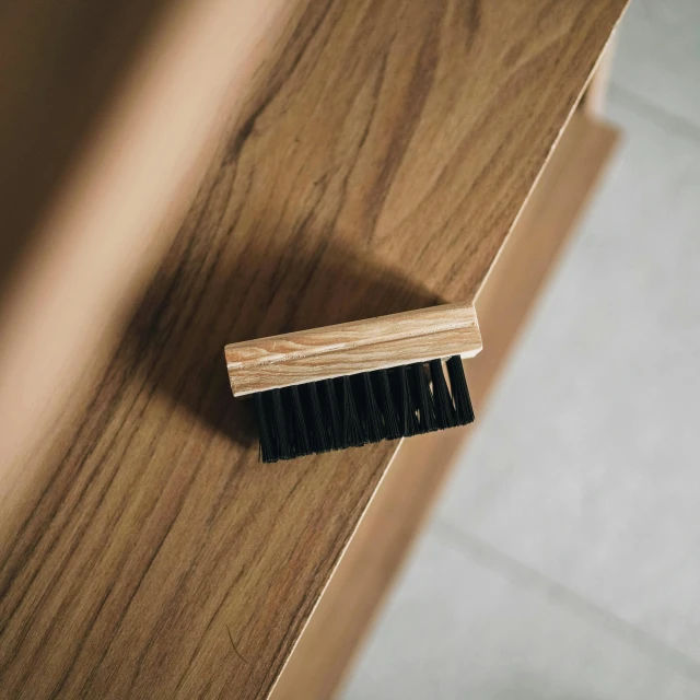 closeup of a small toothbrush on the floor