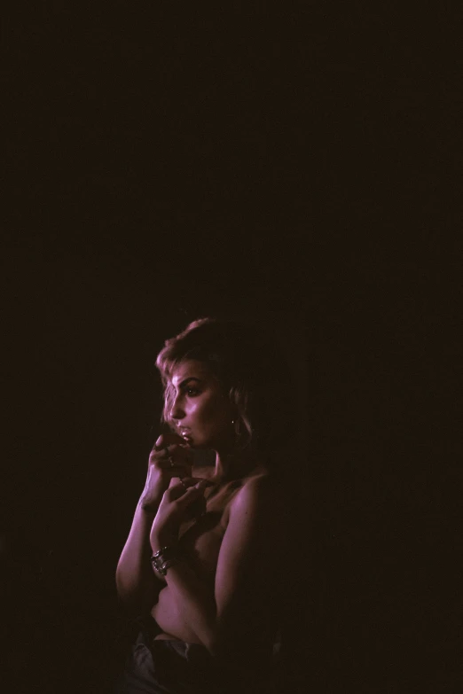 a woman standing outside and talking on the phone