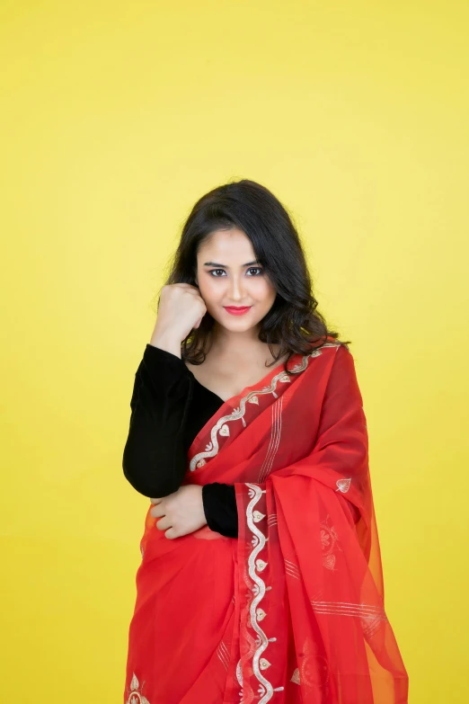 a woman is wearing an orange scarf and posing for the camera