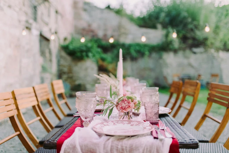 the dining table has two place settings on it