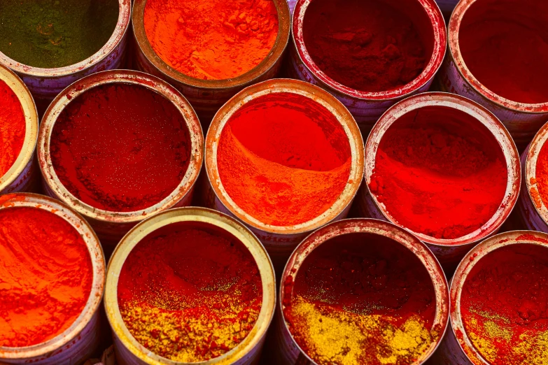 multiple color pots that are full of different colored liquids