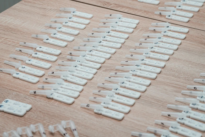 the dominos are set and laid out on a wood surface