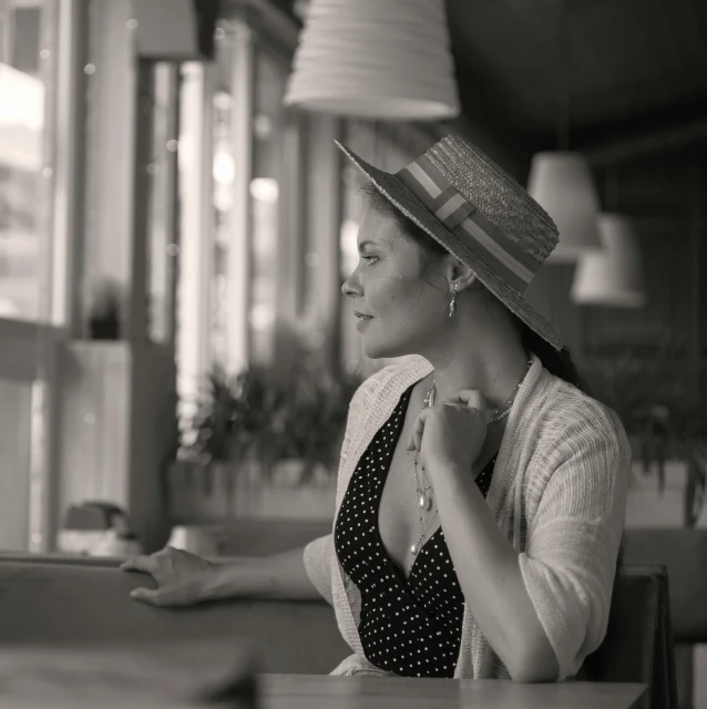 black and white pograph of a woman in hat