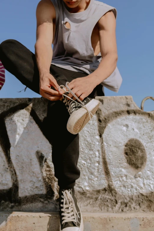 the man is tying his shoes before his run