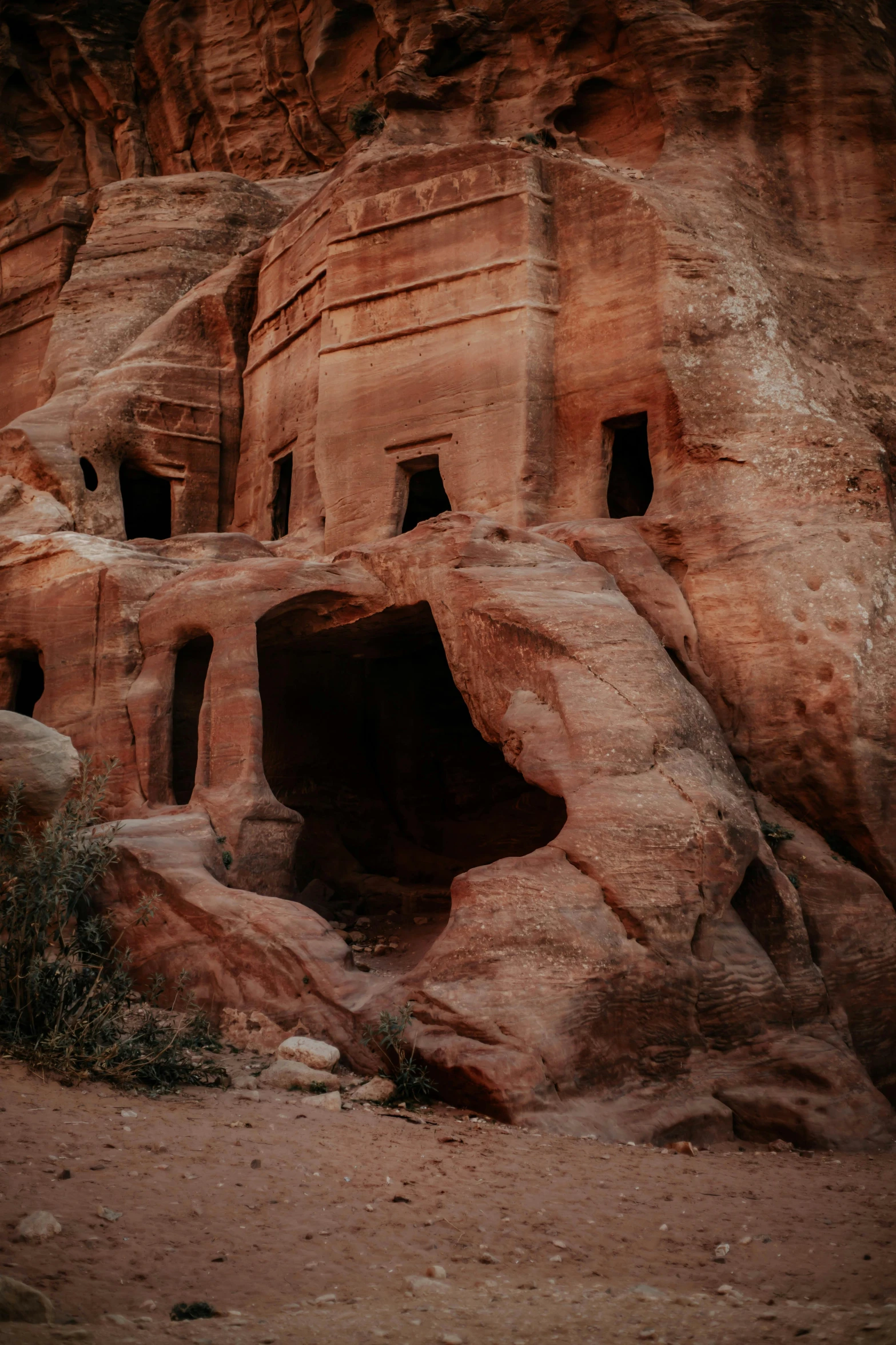 the rock house is carved into the side of the cliff