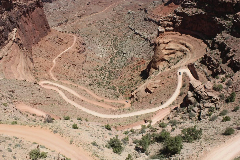 a long curve shaped road in a canyon