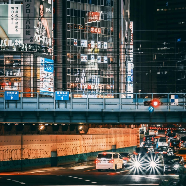 a city street filled with traffic and tall buildings