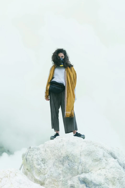 woman standing on a hill covered in white stuff