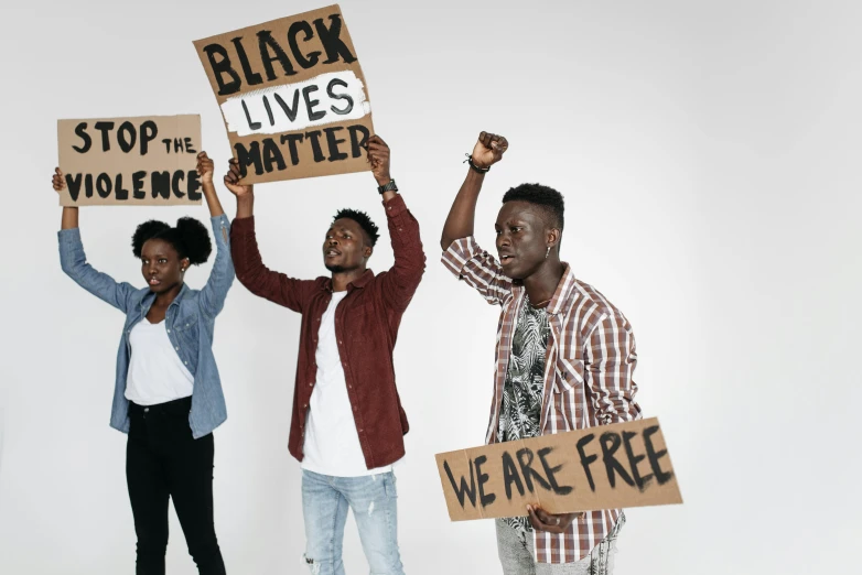 people standing around each other with signs