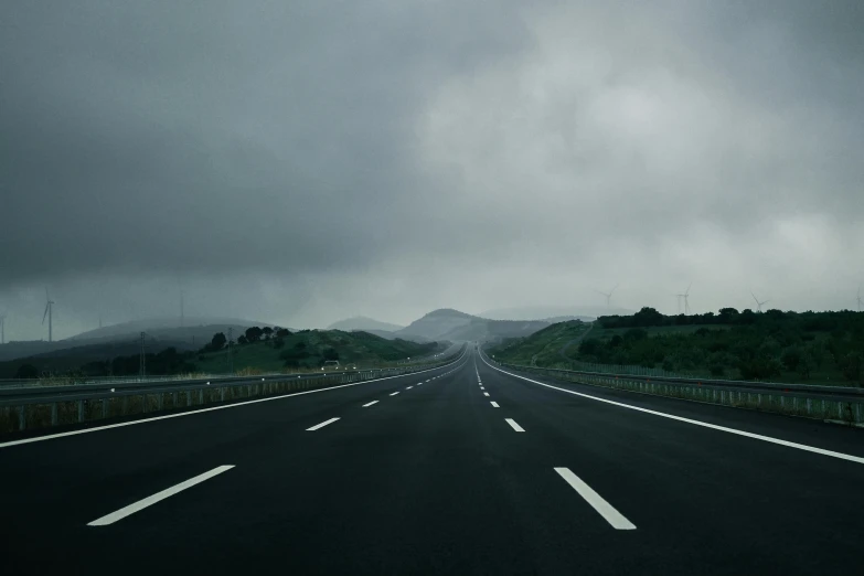 a black and white po of road in the middle of nowhere